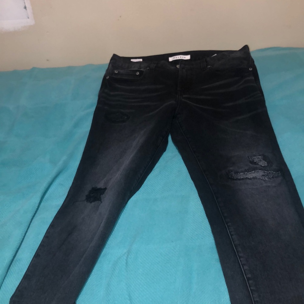 Black ripped and repaired pacsun skinny jeans